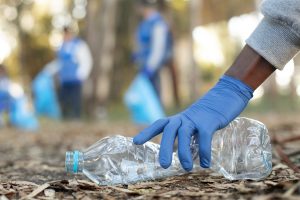 close up hand holding plastic bottle